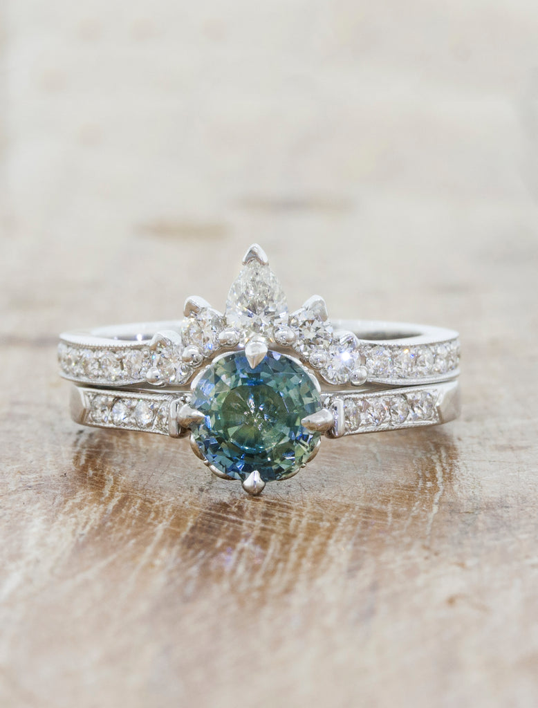 caption:Shown with a green sapphire, paired with a custom Laxmie wedding band.