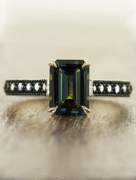 emerald cut green sapphire ring, black rhodium band caption:3.04ct. Emerald Cut Sapphire 14k Yellow Gold