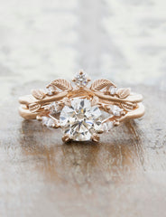 caption:Custom Adelixa with two extra diamonds.  Shown here with the Adamaris engagement ring
