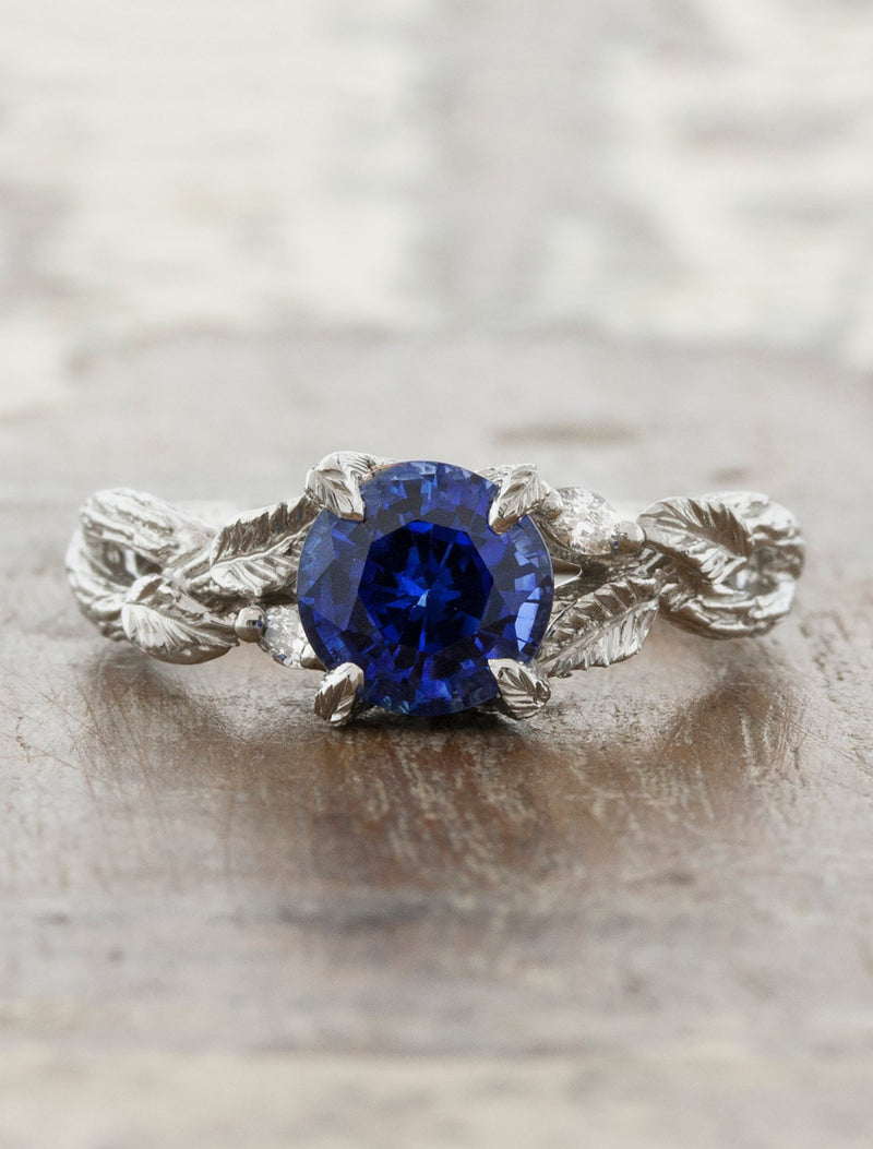 caption:Shown with round blue sapphire in platinum