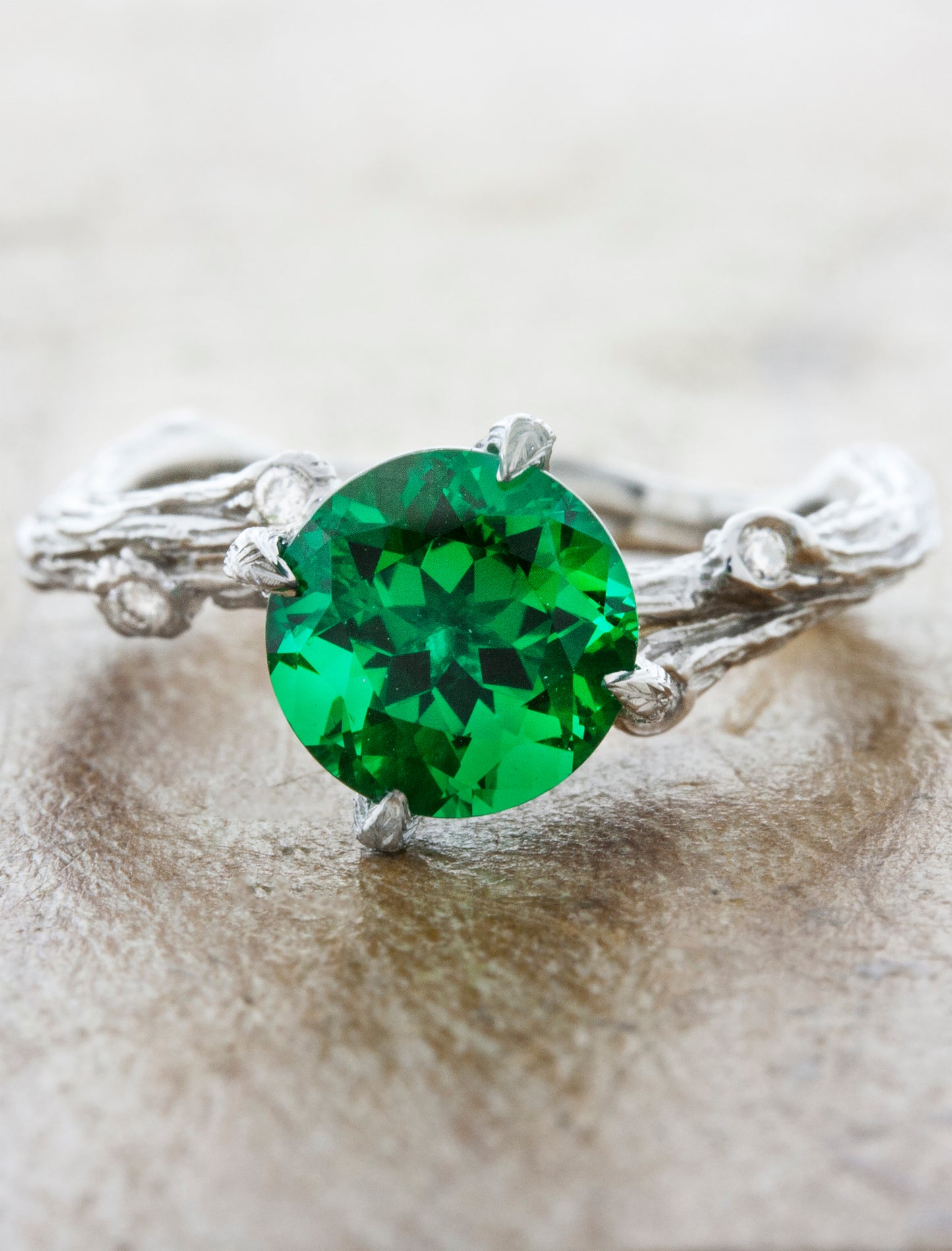 caption:Customized with a cultured emerald