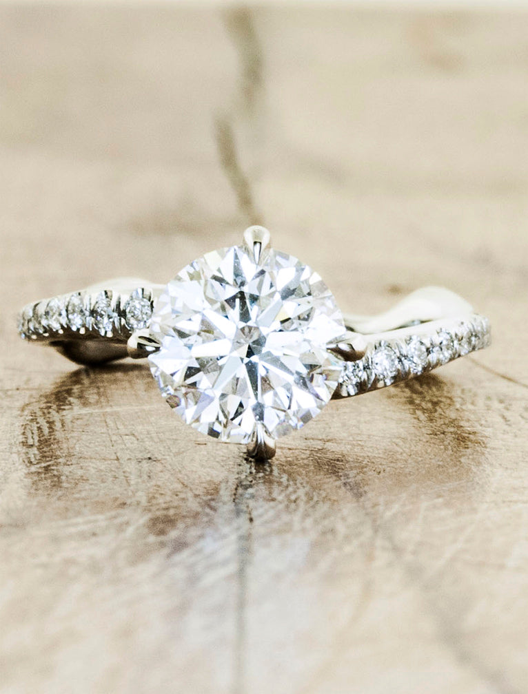 Nature inspired solitaire pave engagement ring;caption:1.50ct. Round Diamond Platinum