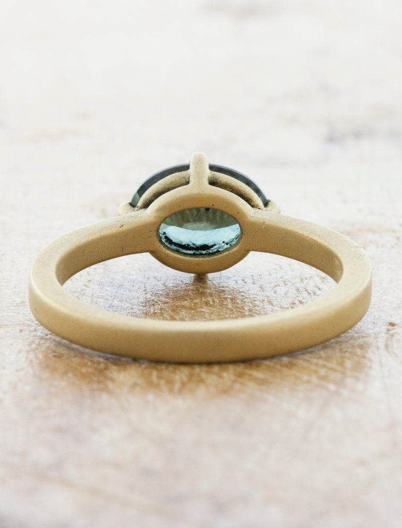 unique & modern sideways oval sapphire in brushed yellow gold band