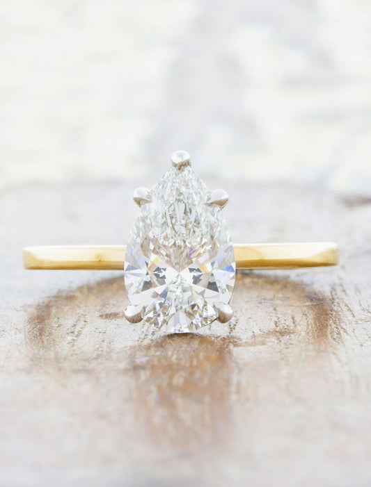 caption:Shown with a 1.5ct pear diamond in mixed platinum & yellow gold