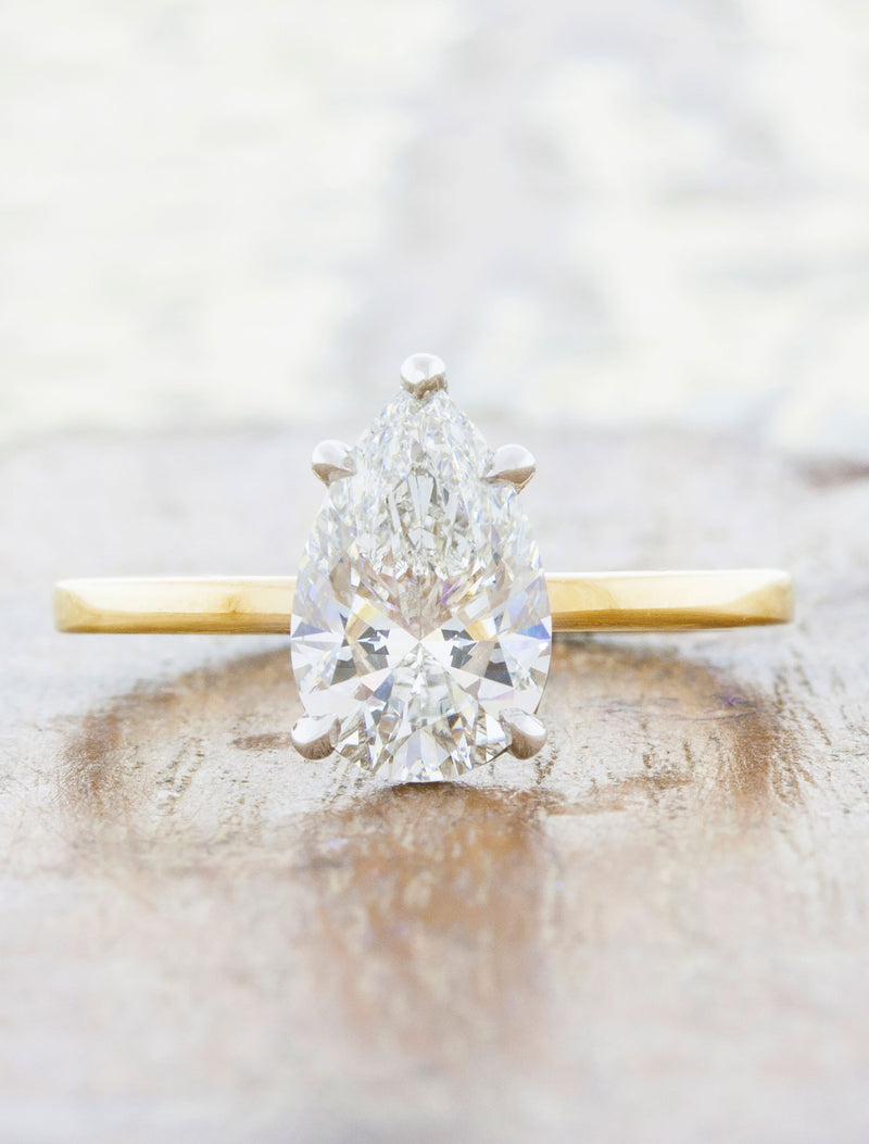 caption:Shown with a 1.5ct pear diamond in mixed platinum & yellow gold