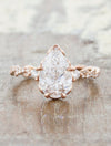 caption:Shanel engagement ring with 1.5ct pear diamond in 14k rose gold