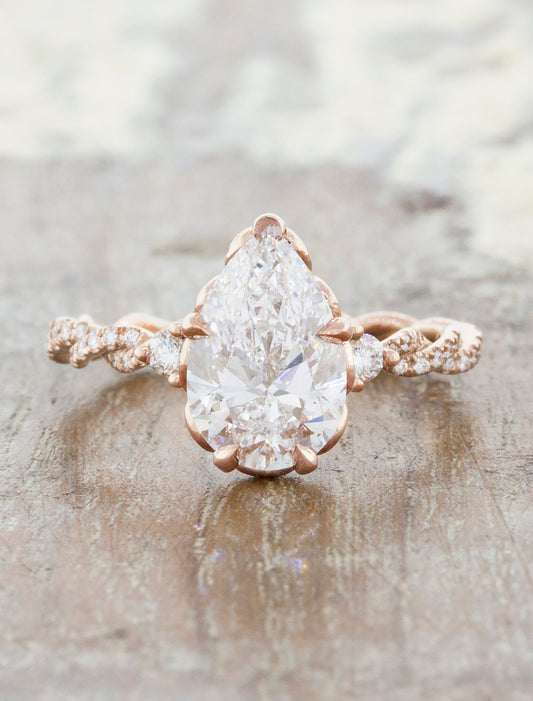caption:Shanel engagement ring with 1.5ct pear diamond in 14k rose gold