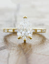caption:Shown with 1.5ct pear diamond in 14k yellow gold