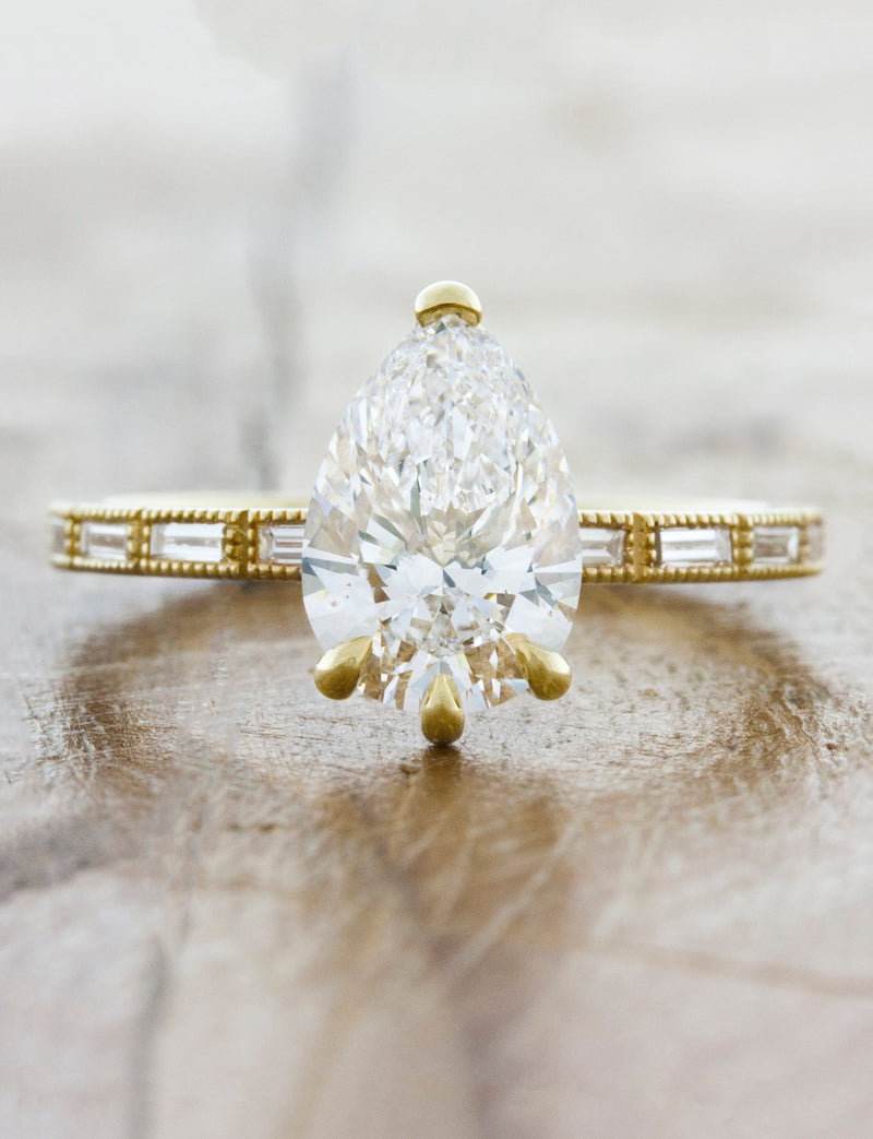 caption:Shown with 1.5ct pear diamond in 14k yellow gold