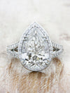 caption:Shown with 4ct pear diamond in platinum