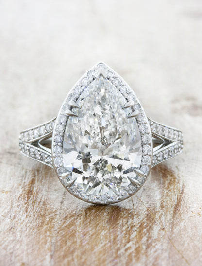 Halo engagement ring with split shank;caption:4.27ct. Pear Diamond Platinum