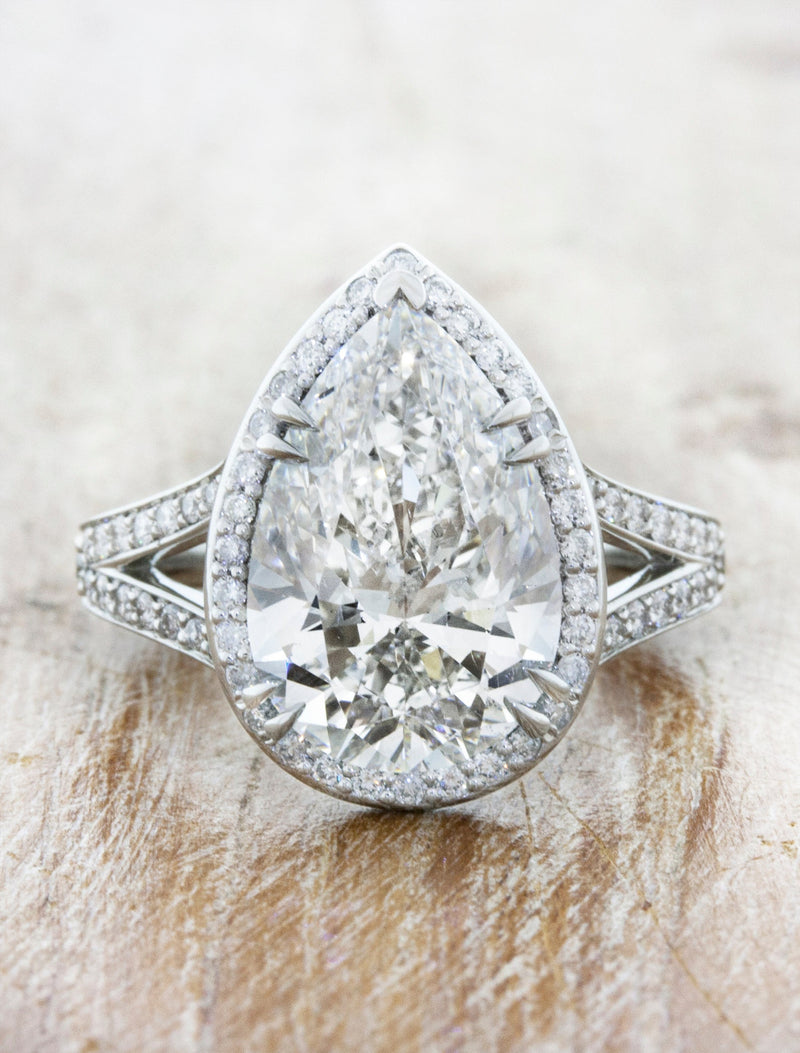 caption:Shown with 4ct pear diamond in platinum