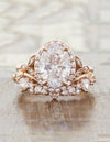 oval solitaire and curved wedding band with trillion diamonds