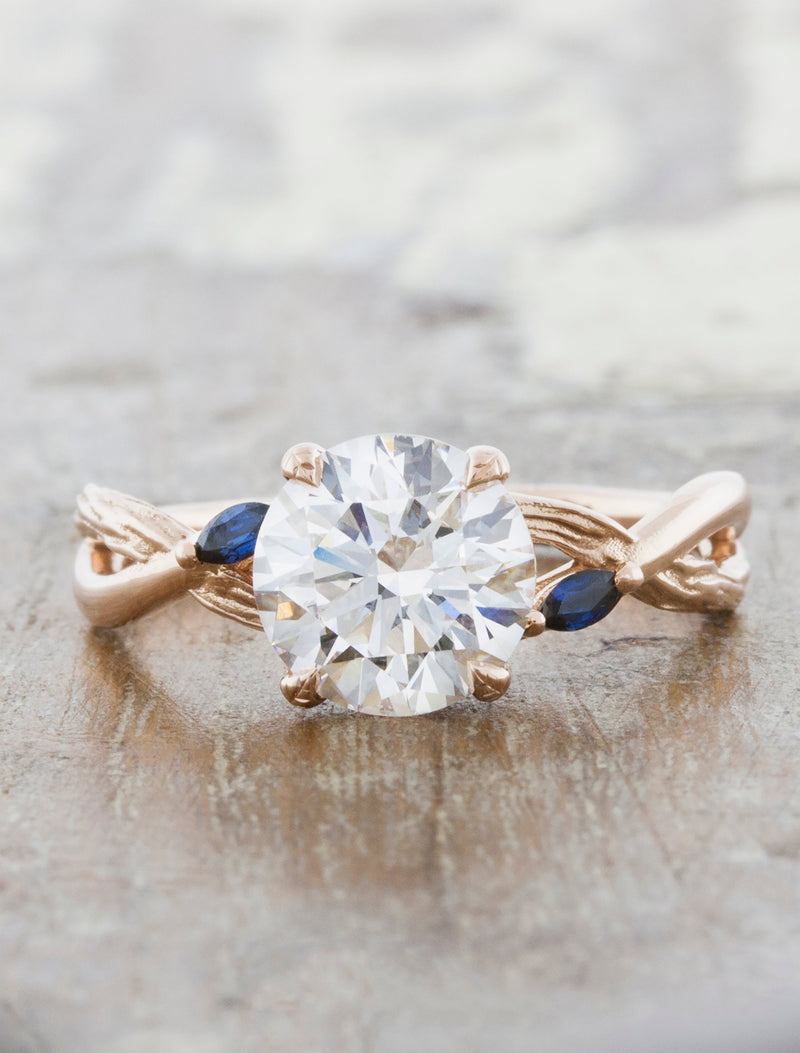 caption:Customized with blue sapphire accents in 14k rose gold