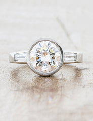 Three Stone Baguette Diamond Engagement Ring caption: 2.00ct Round Diamond on a Platinum Bezel Set Band