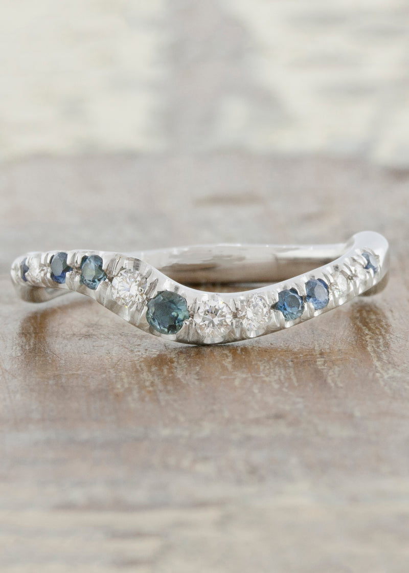 caption:Customized with blue sapphires in platinum