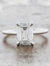 caption:Shown with 2ct emerald cut diamond in platinum