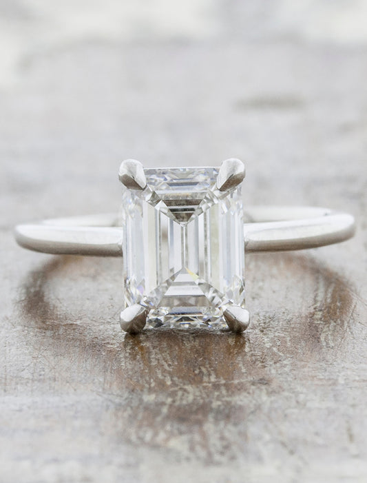 caption:Shown with 2ct emerald cut diamond in platinum