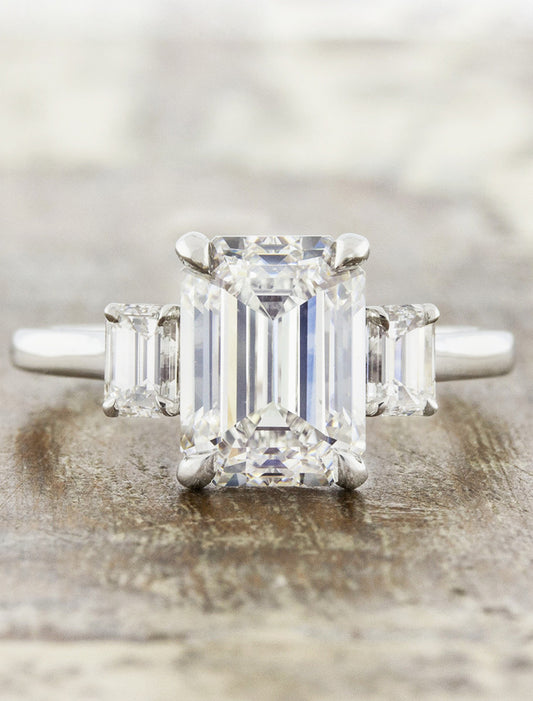 caption:Shown with 3ct emerald cut diamond in platinum
