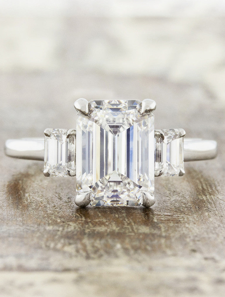 caption:Shown with 3ct emerald cut diamond in platinum