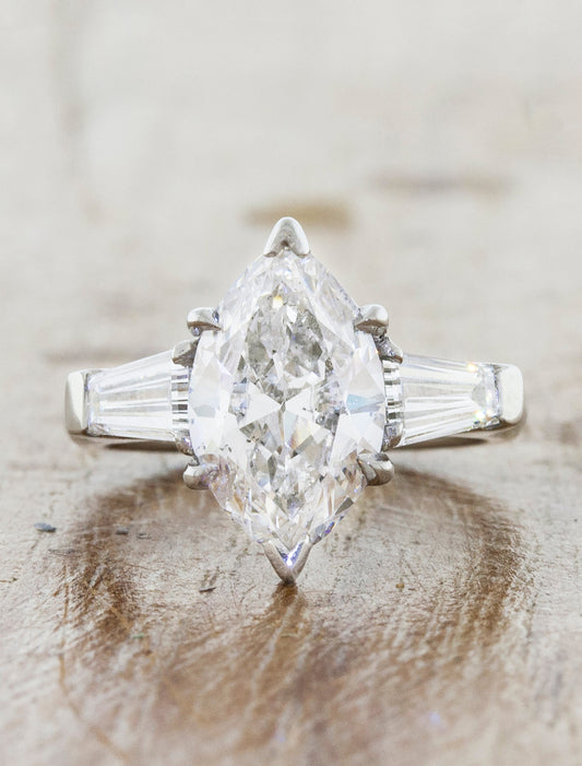 caption:Shown with marquise diamond in platinum