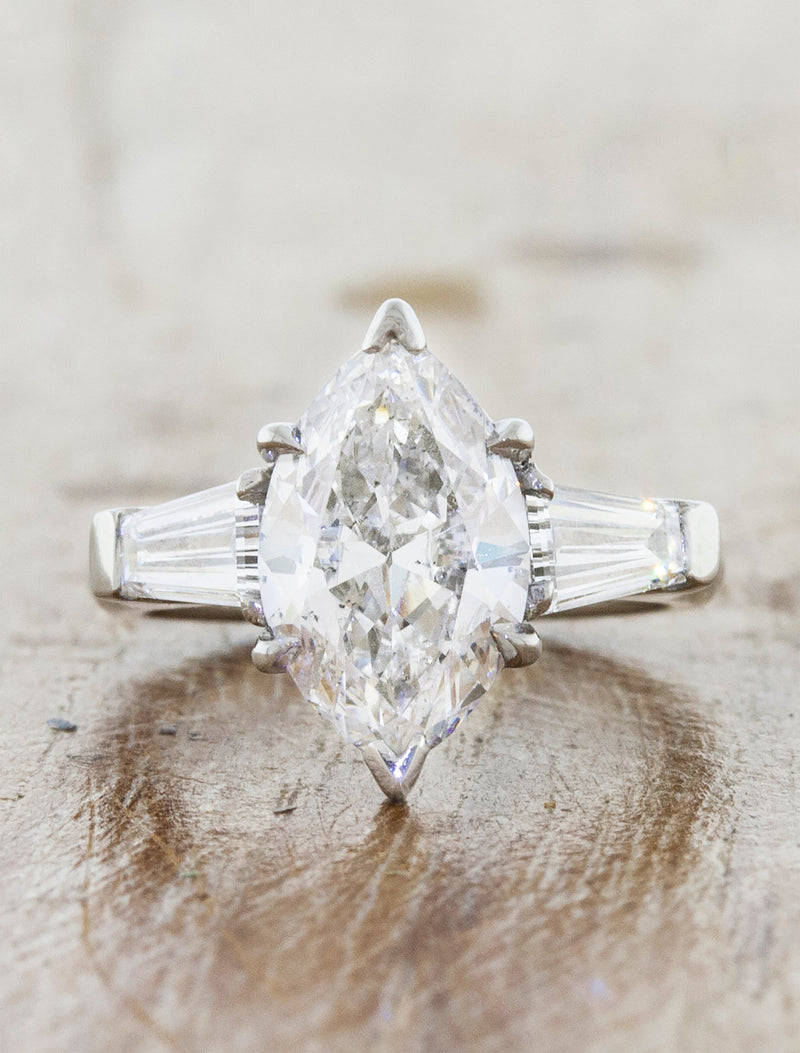 caption:Shown with marquise diamond in platinum