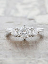 caption:Shown with 5.85mm round diamond center stone & 4mm side stones in platinum