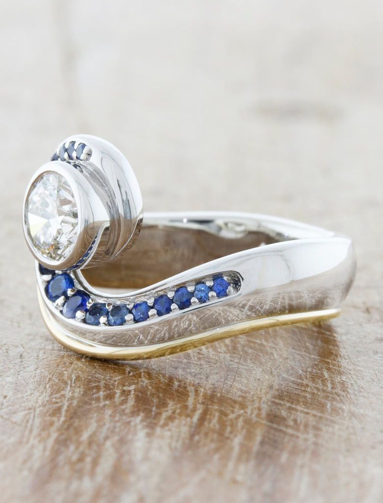 Wave like diamond ring adored with sapphires