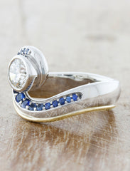 Wave like diamond ring adored with sapphires