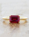 caption:Customized with emerald cut ruby & added diamond accents