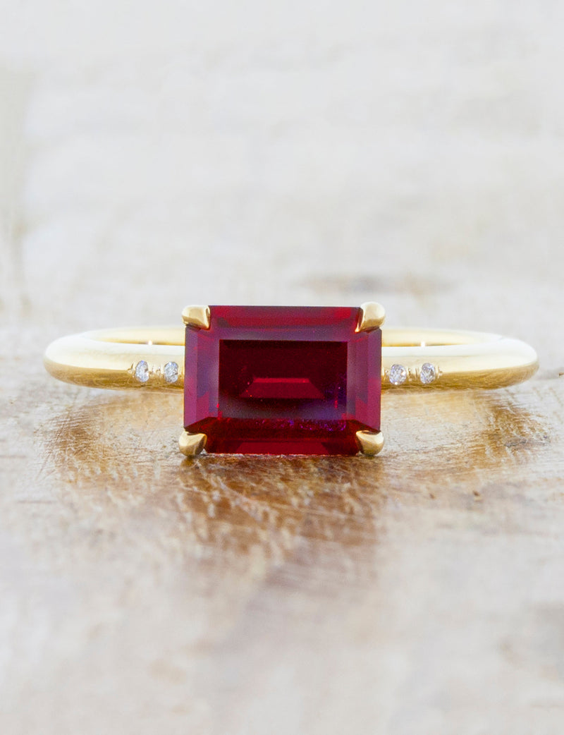 caption:Customized with emerald cut ruby & added diamond accents