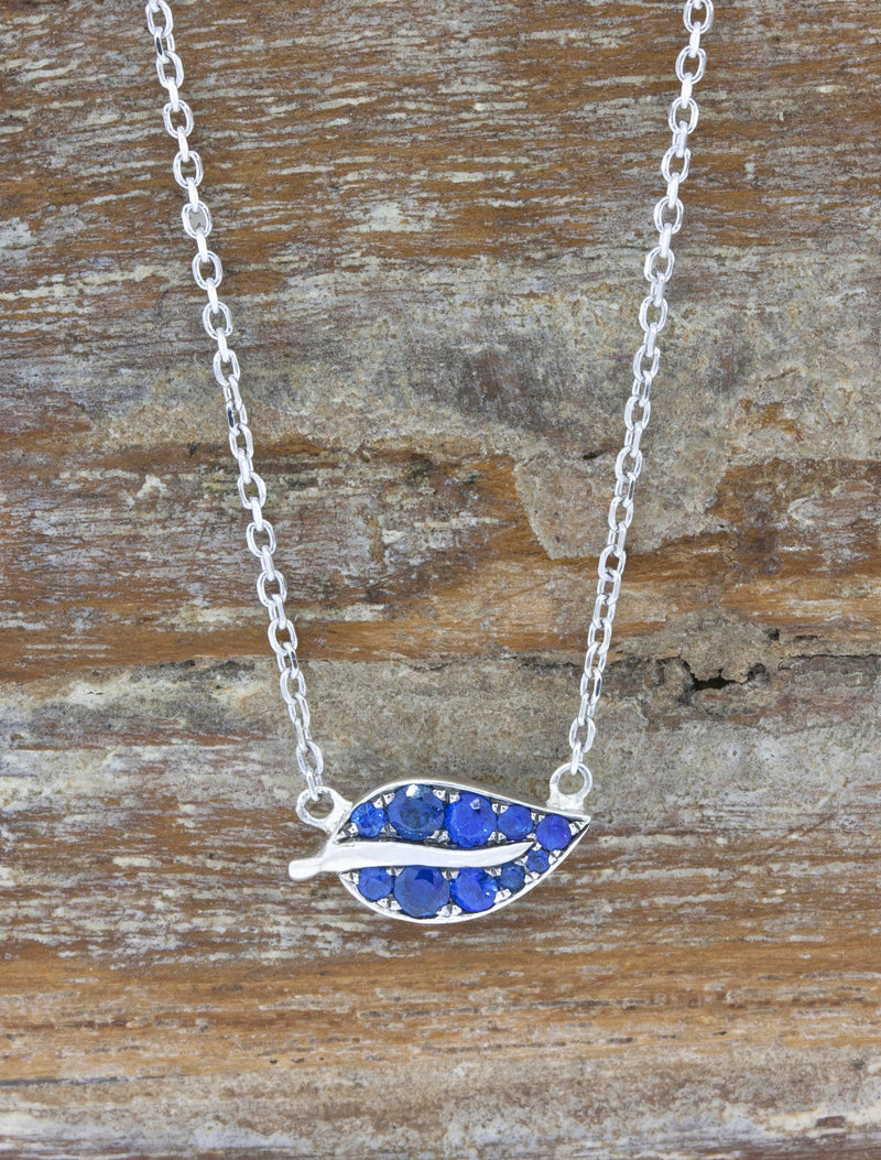 caption:Customized with blue sapphires in platinum