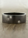 unique men's dark metal wedding ring, diamond accents caption:Black rhodium plating option shown