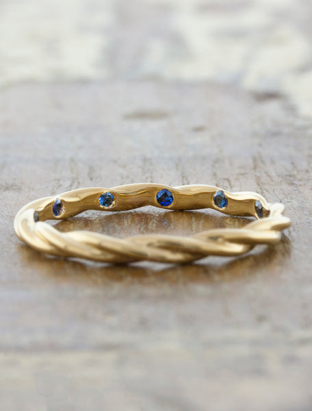 caption:Customized with blue sapphires set in the inside