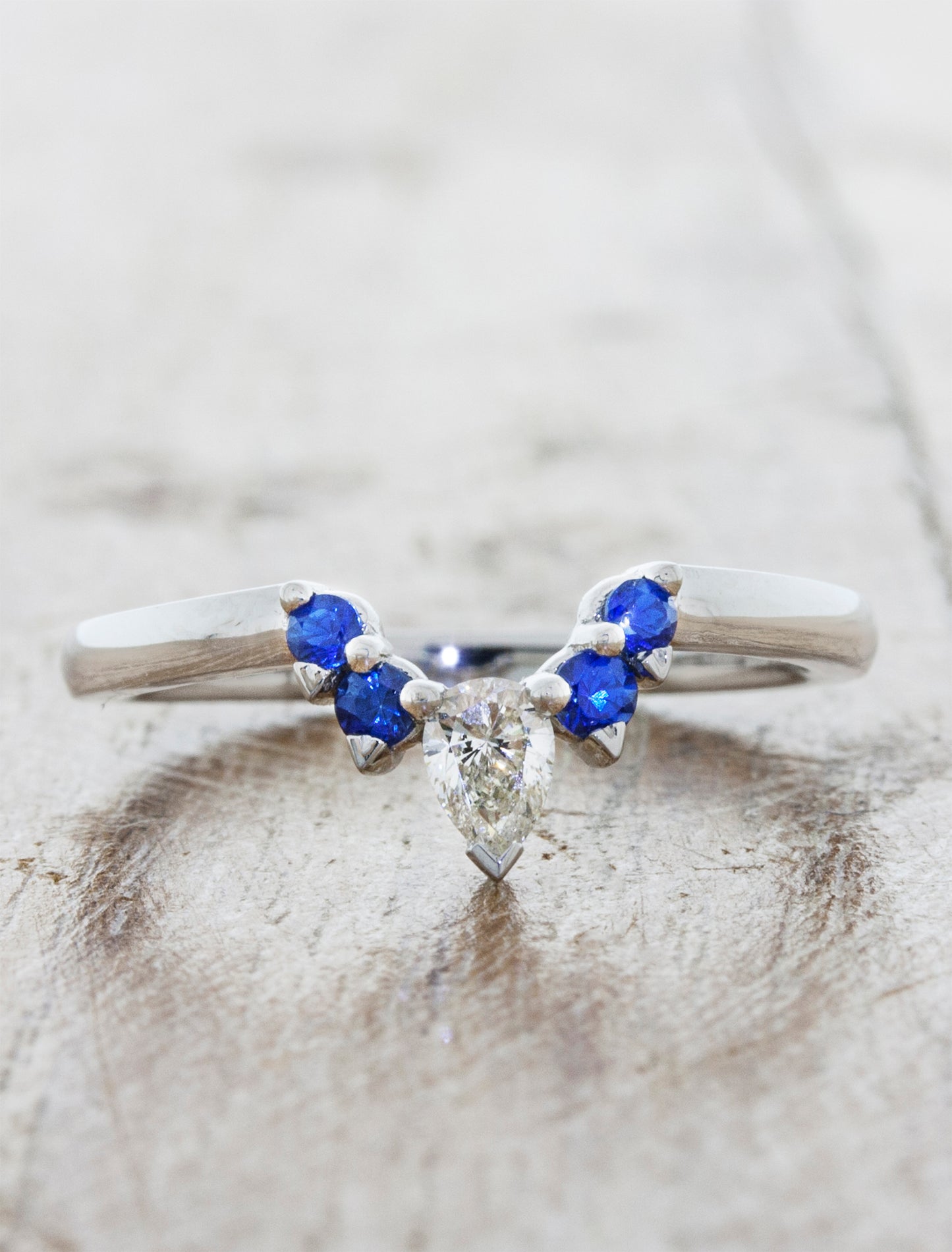 caption:Shown in platinum and customized with blue sapphires