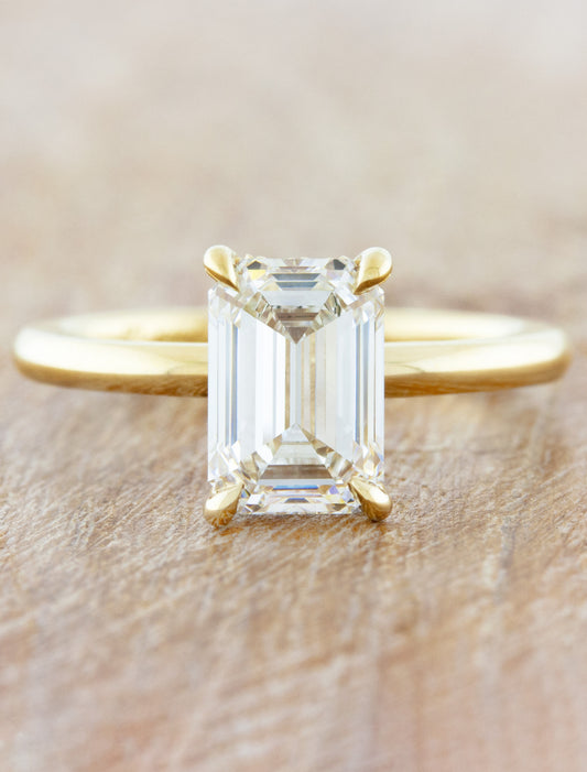 caption:Shown with 1.75ct emerald cut diamond in 14k yellow gold