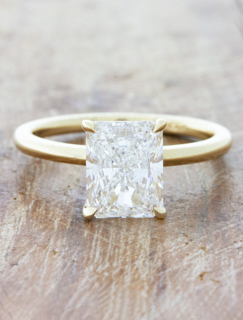 caption:Shown with 2.5ct radiant cut in 14k yellow gold