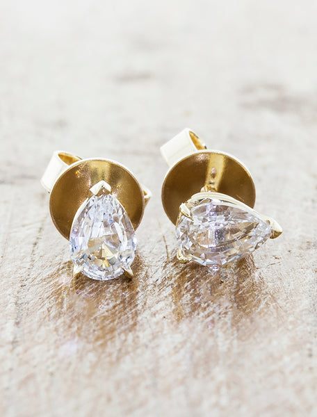Pear Shaped diamond Stud Earrings. caption:Shown in 1ct total weight option, 14k yellow gold
