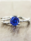 caption:Customized with round blue sapphire in platinum