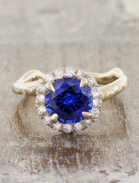 Nature inspired engagement ring halo;caption:1.85ct. Round Sapphire 14k Yellow Gold customized with diamonds in the band