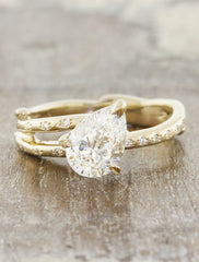 Nature inspired engagement ring leaf prongs;caption:Customized with an 1.10ct. Pear Diamond 14k Yellow Gold