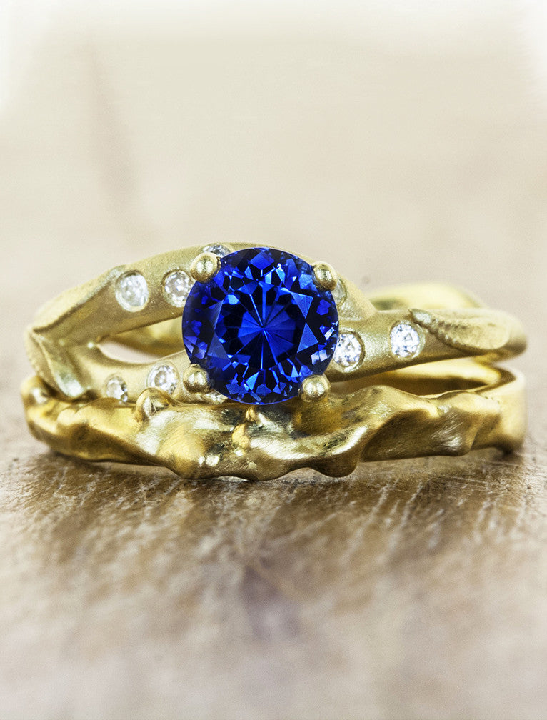 gold asymmetric band, round sapphire engagement ring