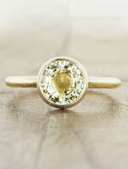 caption:Customized with a yellow sapphire