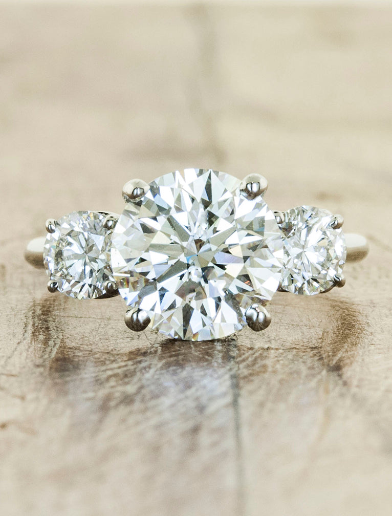 three stone diamond engagement ring. caption:Shown with a 2.22ct center diamond in platinum