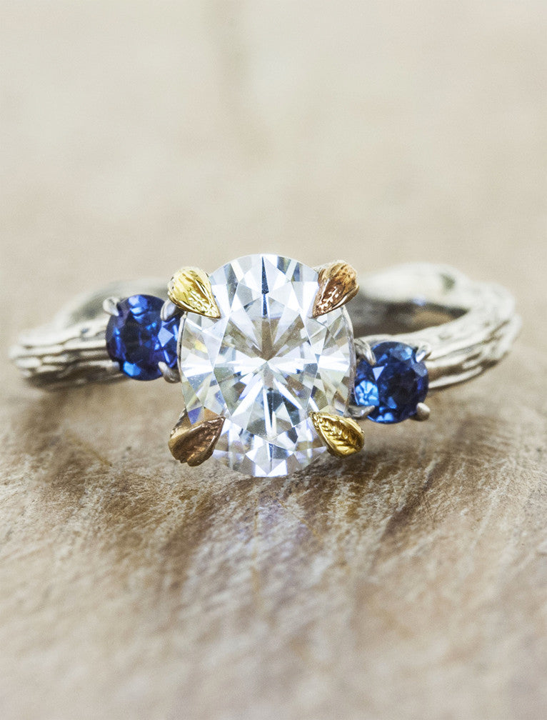 caption:Shown with oval diamond with alexandrite side stones in mixed yellow gold & platinum