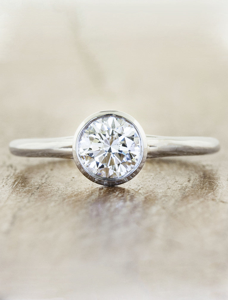 clean bezel set diamond engagement ring. caption:Shown in 0.7ct diamond option