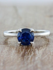 Engagement ring tapered band;caption:Customized with a 1.50ct. Round Sapphire Platinum