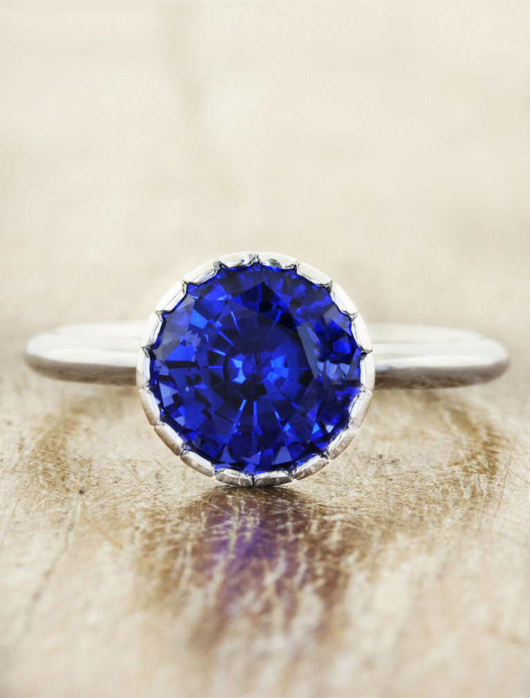 caption:Shown with blue sapphire in platinum
