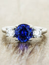 caption:Customized with blue sapphire center stone in platinum