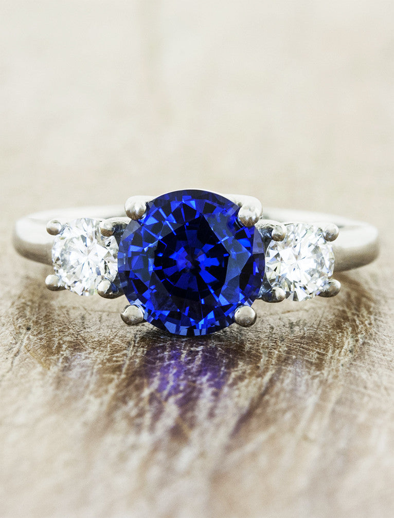 three stone diamond & sapphire engagement ring. caption:Customized with blue sapphire center stone in platinum